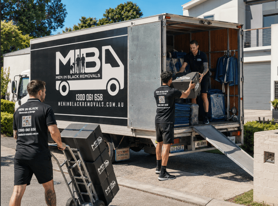 Three professional removalists with a 14 tonne moving truck in Sydney CBD