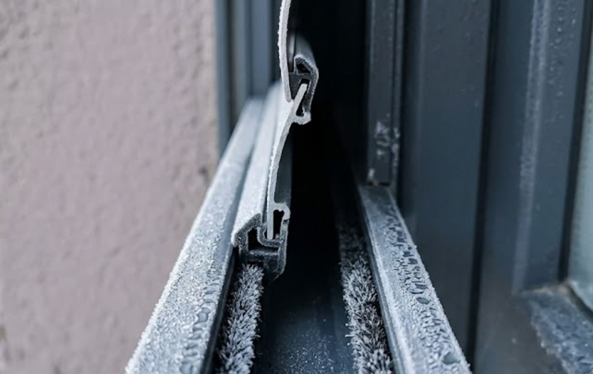 Roller shutter track affected by cold weather contraction