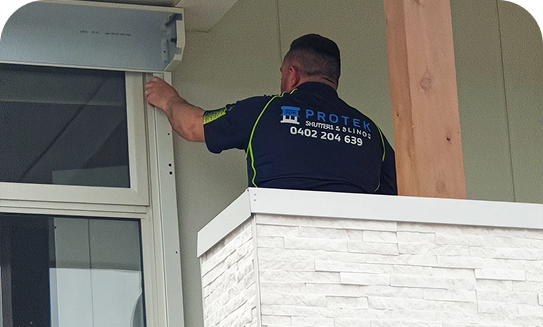 Installer working on a window shutter